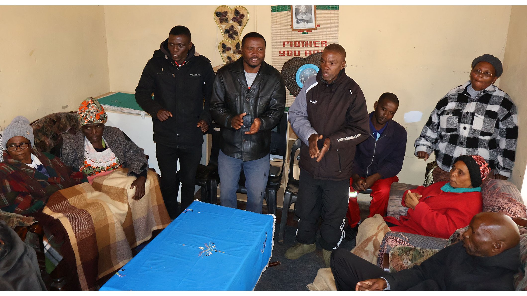 Former Ngwempisi MP Mthandeni Dube’s mother Kesta (77) (L) with other family members, friends and neighbours during the prayer service yesterday.